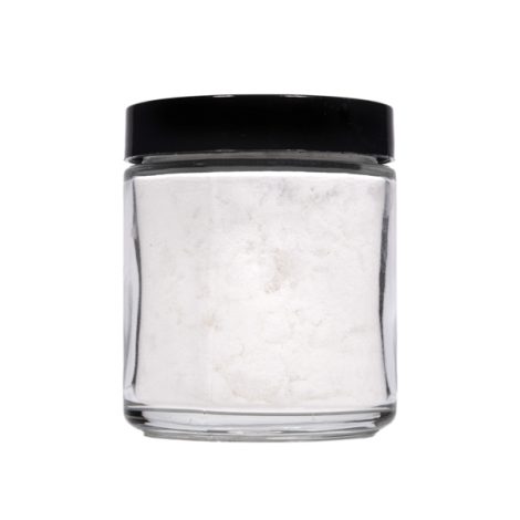 Side profile of a small, transparent jar with a black lid, filled with pure white CBD isolate powder, available for bulk purchase to supply manufacturers and wholesale clients.